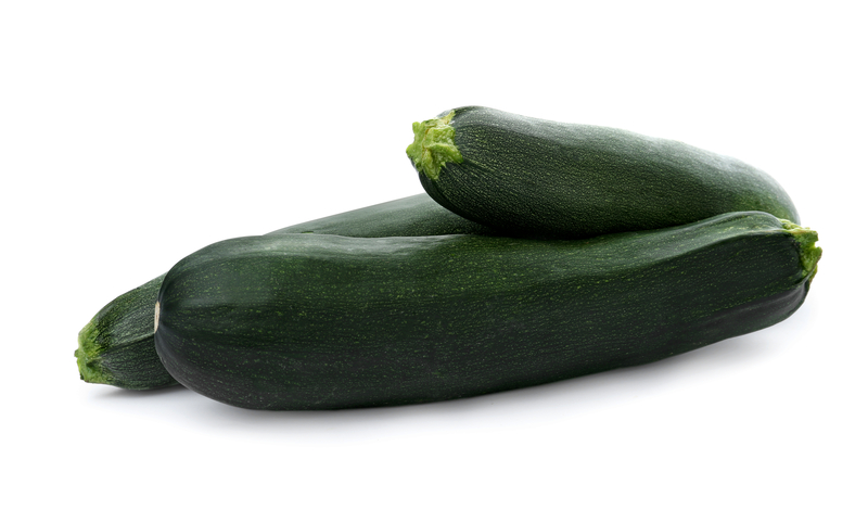 Photo of zucchinis on a white background